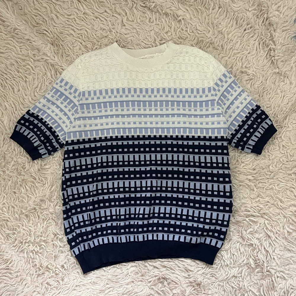 Blue and white striped sweater with a retro vibe